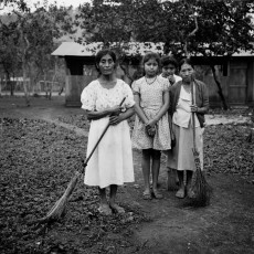 These women and others sweep the community every two weeks. Ninety-two families of the Popular Communities in Resistance of the Petén left their jungle hiding place and moved to these lands in late 1998. Salvador Fajardo community, Petén, 2001