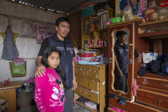 Reiner Ipurre with his daughter. Reiner is the son of Benadicta Inca (9/30). His father, Bernardo Ipurre Tacsi, was disappeared in 1984 in Hualla, in the Ayacucho region. Lima, 2013