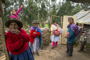 Benita Pariona de Arango (on the left) in her house with her daughter and some of their neighbors. In 1984 soldiers killed Benita’s husband, Filemón Arango Soca. Seven years later the Shining Path killed her oldest son. Another of her sons was killed by the police. Ñuñunhuaycco, Ayacucho Region, 2014