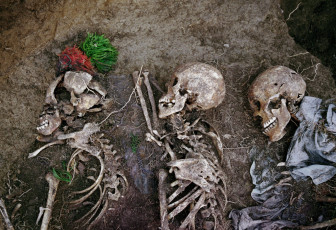 The remains of Domingo’s father, mother and wife. He buried seven family members here during the night after soldiers killed them as they were fleeing into the mountains in August 1982. Nebaj, 2000