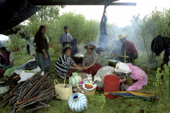Preparing lunch at the site of an exhumation. Amidst so much pain and grief, at times there is still joy and laughter. Nebaj, 2001