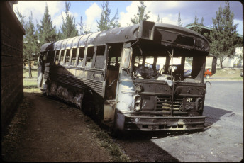 One of several city buses that were burned by people protesting against bus fare increases. Outside of the San Carlos University in Guatemala City, 1995